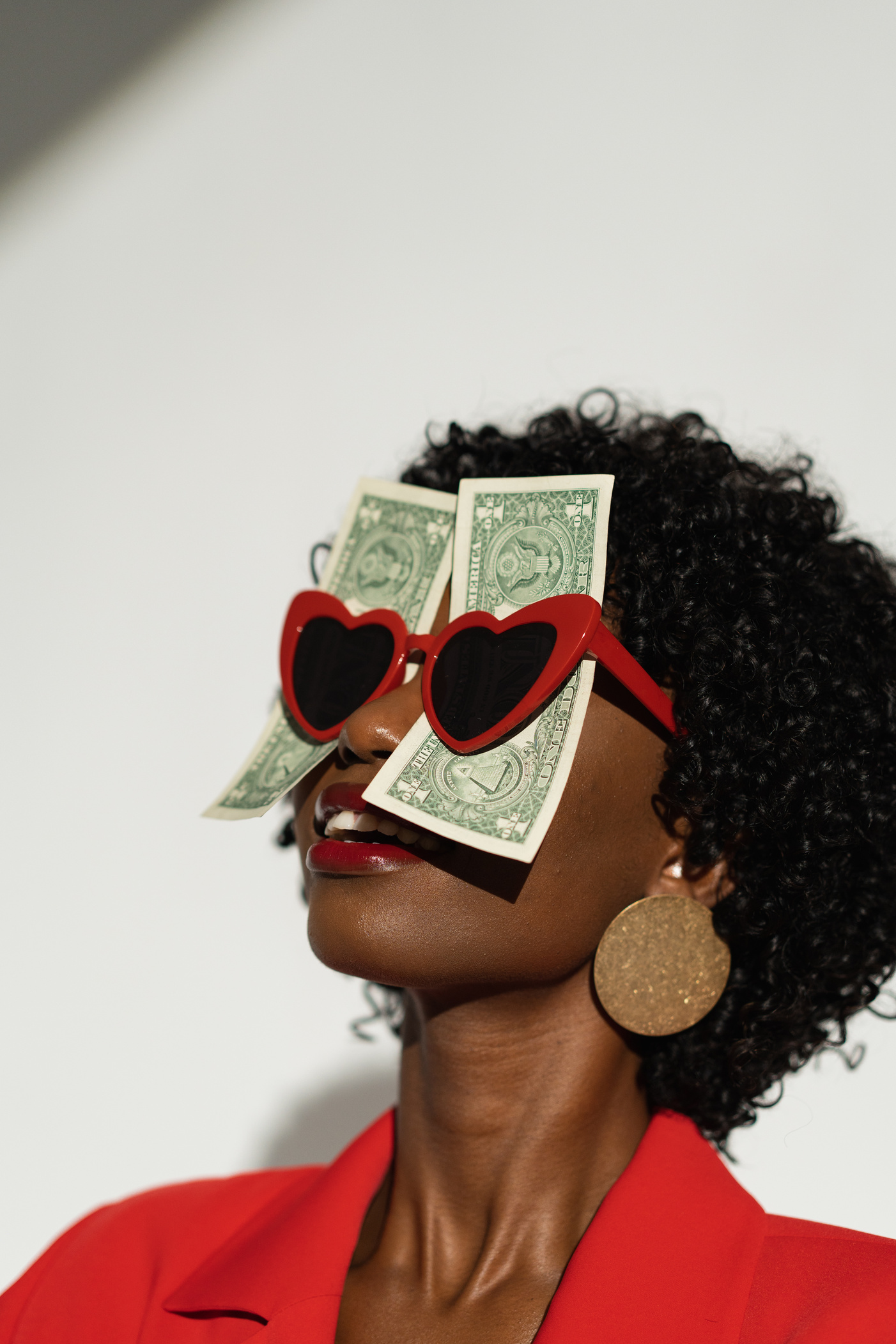 Woman Wearing Red Heart Sunglasses with Money